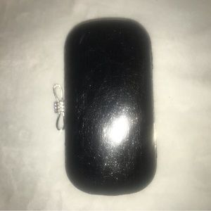 Woman’s Black Clutch with strap. Cute lill sparkly Bow On top. Used a few times.